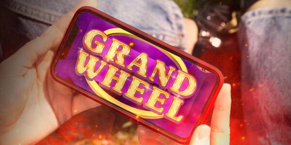 cellulare che mostra la slot online Grand Wheel